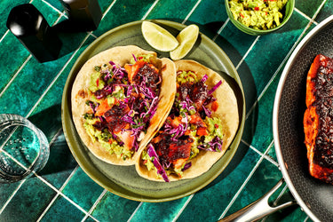 Honey and Harissa Salmon Tacos on a plate