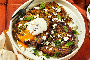 Summer Courgette, Feta, Mint, and Pea Fritters with Poached Eggs